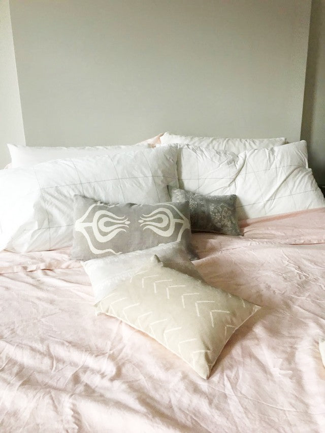 bed with pillows on it
