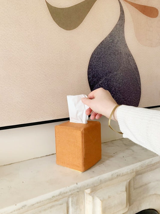 hand reaching for tissue box